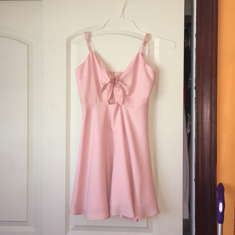 pink dress with cut out and bow